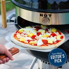 the kettle pizza turns your grill into