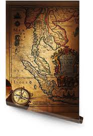 brass compass over antique thailand map