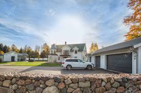 If you have a one‑car garage, the you will find that rv‑specific garage doors are a minimum of 12 feet tall (3.5 m). Big Family House With Double Size Garage And Car Parked In Front Stock Photo Picture And Royalty Free Image Image 89461425