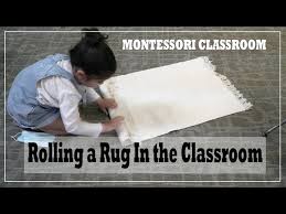 rolling a rug montessori clroom