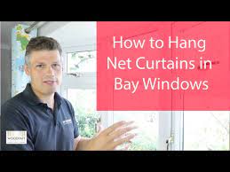 how to hang net curtains in bay windows