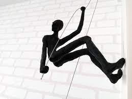 climbing man wall sculpture for