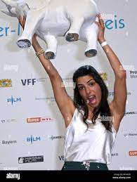 Munich, Germany. 30th June, 2019. The presenter Clarissa Correa da Silva is  delighted about her trophy at the presentation of the Children's Media  Prize 