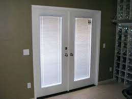 french doors with blinds between the