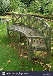 large curved wooden garden bench seat