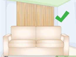 decorate the wall behind a couch