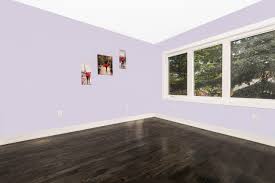75 dark wood floor bedroom with purple