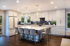 an open concept kitchen dining and