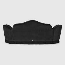capitonné camelback sofa in black