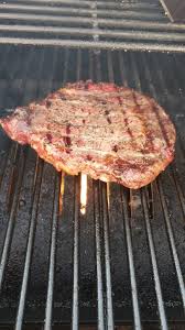 smoked ribeye steak on a pellet grill