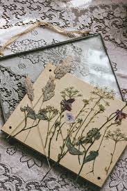 A diy for a pressed flower frame. Pressed Wild Flowers In Glass Frames Pressed Flower Crafts Pressed Flower Art Pressed Flowers