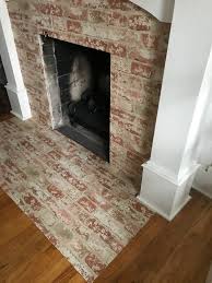 faux brick wallpaper to our fireplace