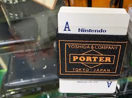 It features a portable console with a screen that can be docked to display on larger displays. Nintendo Playing Cards Exclusively For Porter Yoshida Japan