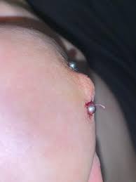 Weird hard string coming from brand new nipple piercing please help : r/ piercing