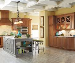 cherry cabinets with a gray kitchen