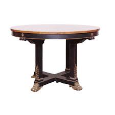 At Auction: ANTIQUE EBONY DINING TABLE
