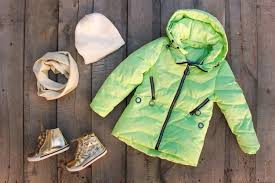 Winter Clothes On Old Wooden Table