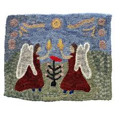 a primitive hooked rug with two angels
