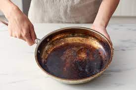 Removing burned on grease doesn't have to require tiresome scrubbing with abrasives, leaving your pans scratched, nor does it have to require any complex setups or expensive materials. How To Clean A Burnt Pot Or Pan How Do You Clean Scorched Stainless Steel Pan Apartment Therapy