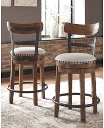 Based on the furniture and space in your office or home, pick a bar stool that's the right size for your room. Valebeck Upholstered Swivel Barstool Ashley Furniture Signature Design Casual Style Light Brown Home Bar Furniture Kolenik Barstools