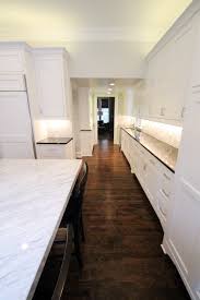Kitchen with decorative oven backsplash. White Marble Kitchen Backsplash Prava Design Build