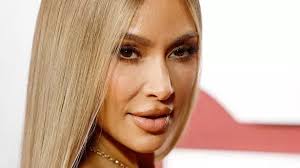 kim kardashian debuts power blond look