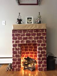 Cardboard Fireplace With Real Wood And Lights As Fire