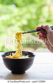 Japanese chopsticks are smaller and shorter, while chinese chopsticks are longer and bigger. Chinese Egg Noodles With Hand Hold Chopsticks On Wood Table Canstock
