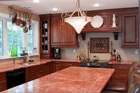 cherry cabinets and black wooden floors