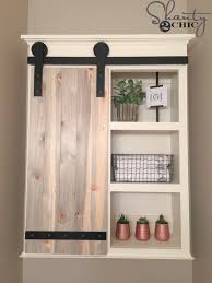How to build paneled sliding barn doors for closet: Diy Sliding Barn Door Bathroom Cabinet Shanty 2 Chic