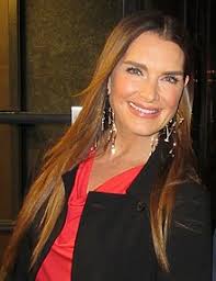 The pictures show brooke in thick makeup and bejeweled, sitting and standing in a steaming, opulent bathtub. Brooke Shields Wikipedia
