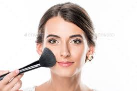 makeup artist applying powder on models