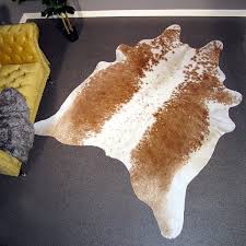 huge tan off white cowhide rug