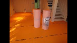 How to tile a large basement floor Part 1 Installing Schluter Ditra -  YouTube