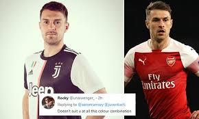 Footballer for arsenal and wales. Arsenal Fans Distraught After Aaron Ramsey Poses In Juventus Shirt Daily Mail Online