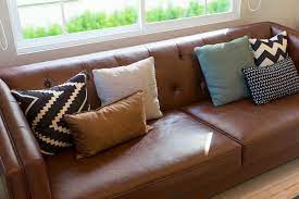 leather sofa with throw hot 50