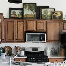 to decorate above your kitchen cabinets