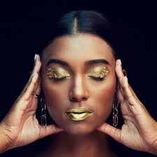 woman face and gold makeup beauty
