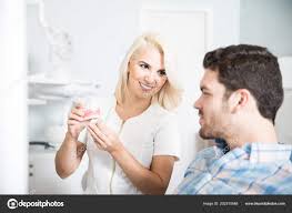 Beautiful Female Dentist Designing Smile Patient Showing Him