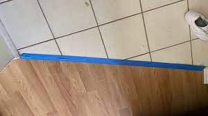 installing a transition strip from tile