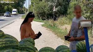 NiP, CMNF video - exhibitionist MILF naked by a roadside kiosk