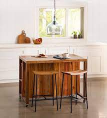 serving kitchen island with 2 stools