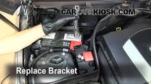 Open the hood, and locate the battery cover on the passenger's side of the vehicle. Mercedes C Class Battery Location