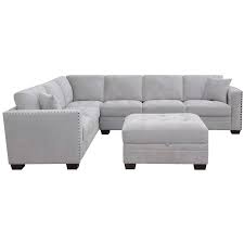 It's covered in a grey fabric, and paired with accent pillows. Thomasville Fabric Sectional With Storage Ottoman Costco Australia