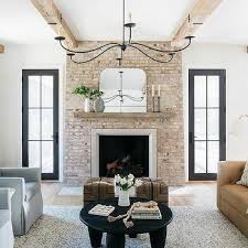 Red Brick Fireplace With White Mantle