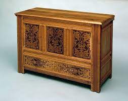 carved frame and panel blanket chest