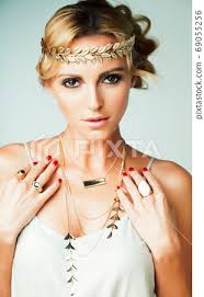 young blond woman dressed like ancient
