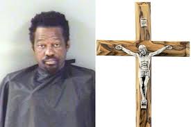 man steals crucifix from strunk funeral
