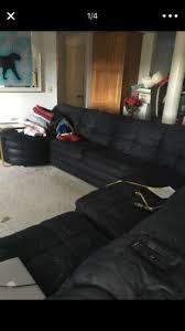 black sectional couch with recliner and