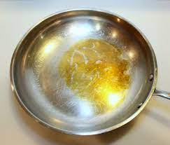 removing burnt oil from a frying pan